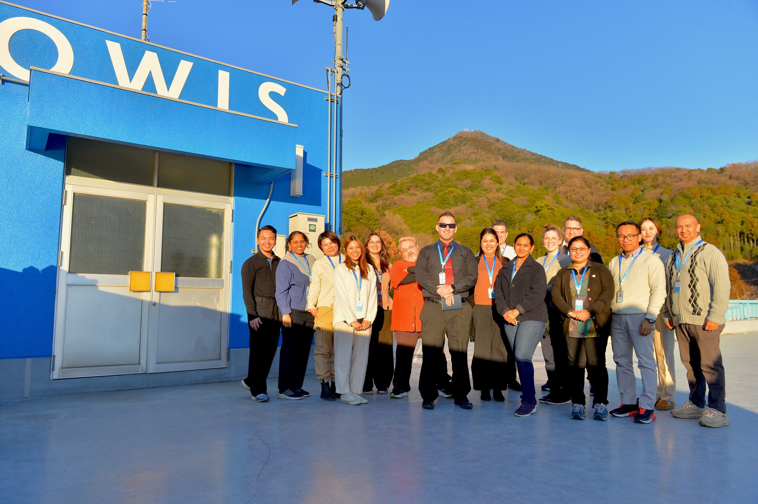 OWIS Tsukuba teachers and staff on the roof - faculty photo with Mt Tsukuba in the back